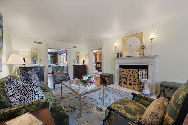 living room with ornamental molding and hardwood / wood-style flooring