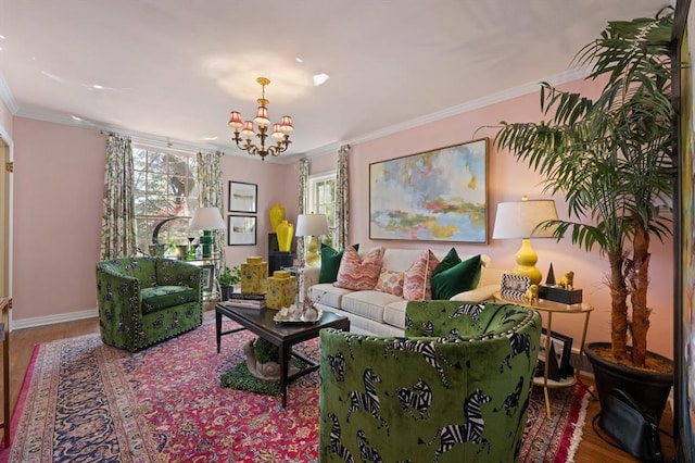 living room featuring an inviting chandelier, ornamental molding, and wood-type flooring