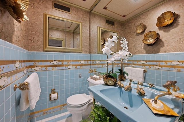 bathroom with toilet and tile patterned floors