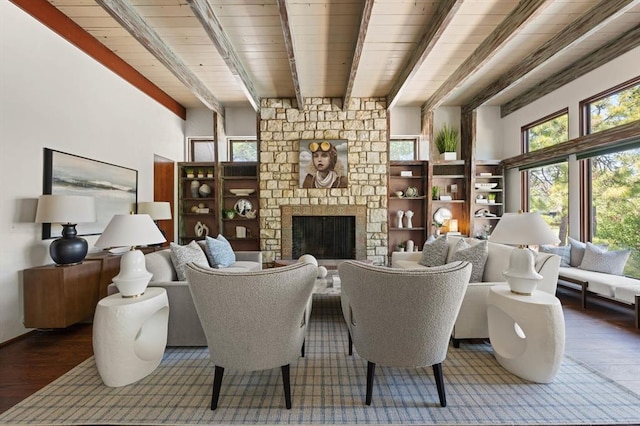 living room with a fireplace, hardwood / wood-style floors, and beamed ceiling