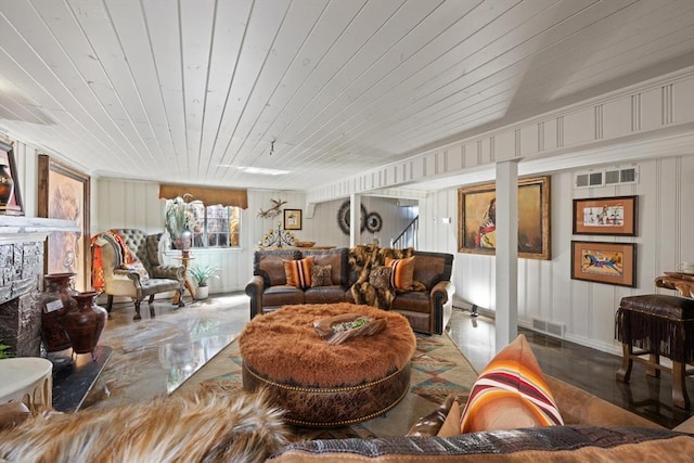 living room featuring wooden ceiling and a high end fireplace