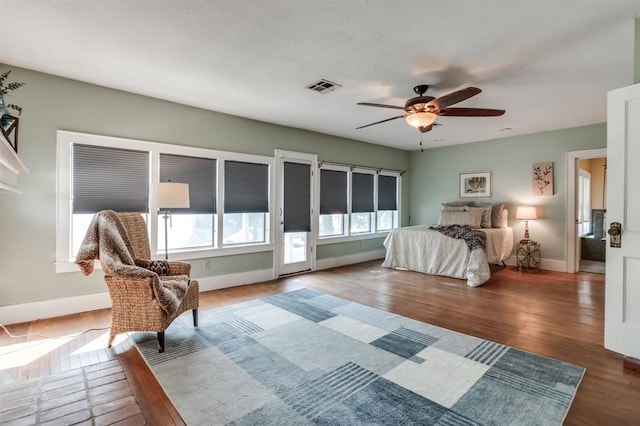 bedroom featuring dark hardwood / wood-style flooring and ceiling fan