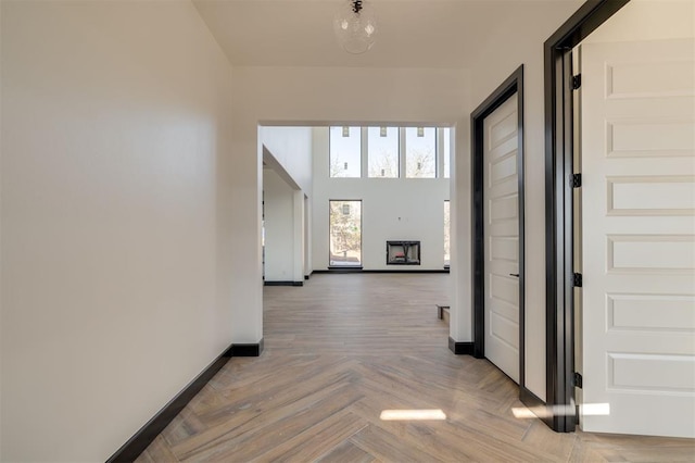 corridor with light parquet floors