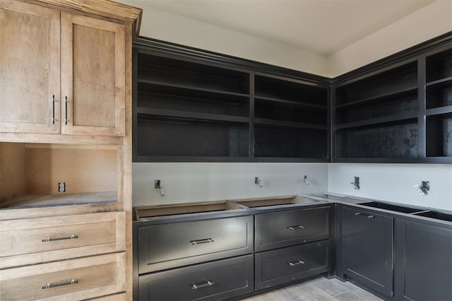 kitchen featuring light hardwood / wood-style floors and light brown cabinetry