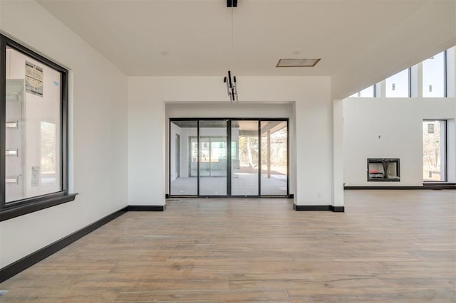 empty room with light hardwood / wood-style floors