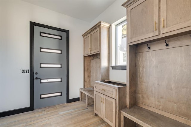 mudroom with light hardwood / wood-style flooring