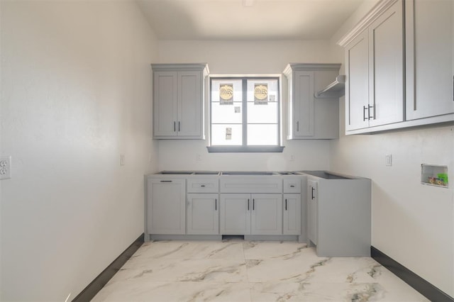 laundry room with hookup for a washing machine and cabinets