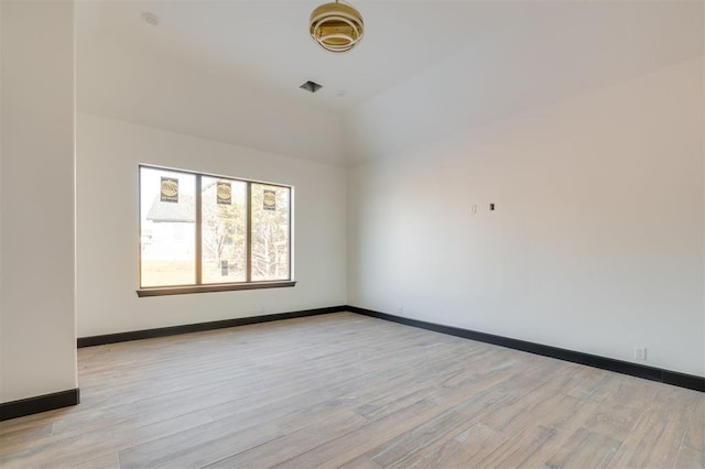 spare room with light wood-type flooring