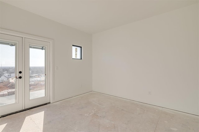 spare room featuring french doors