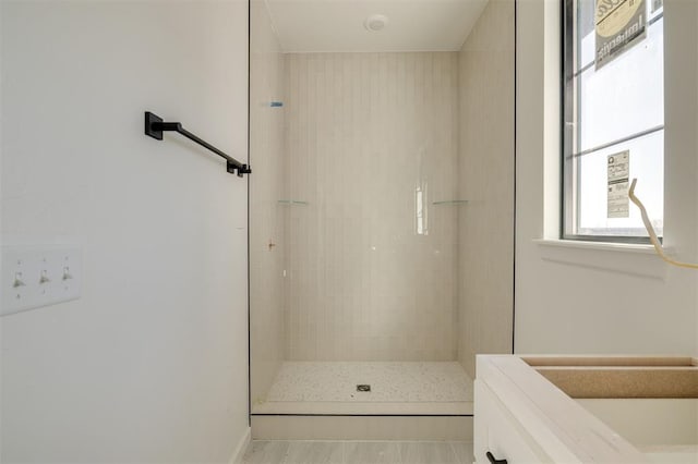 bathroom featuring tiled shower