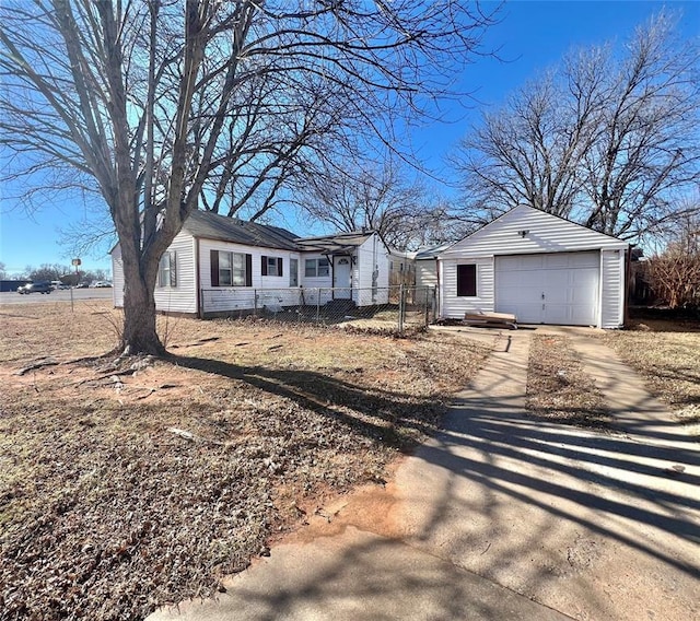 ranch-style home with an outbuilding and a garage