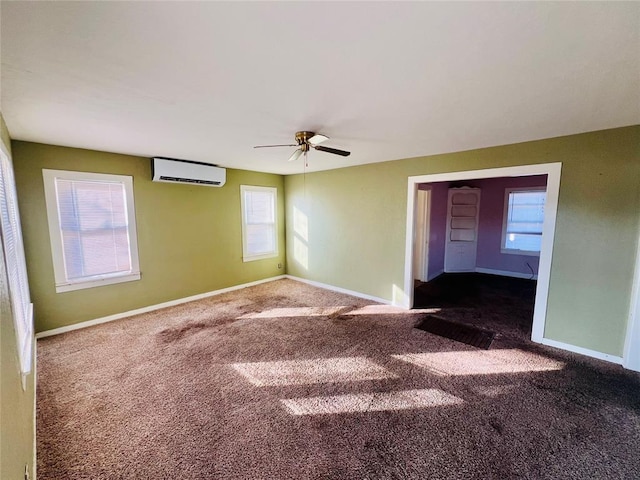 carpeted empty room with ceiling fan and an AC wall unit