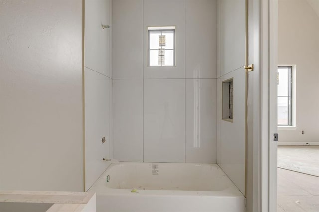 bathroom featuring a washtub