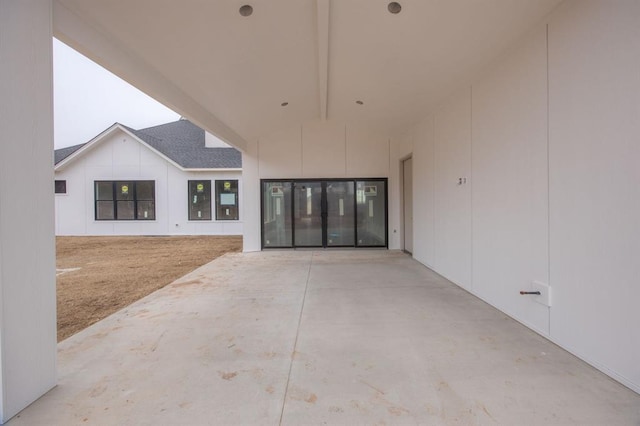 property entrance featuring a patio area