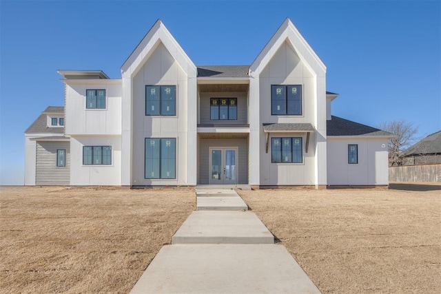 view of front facade featuring a front lawn and french doors