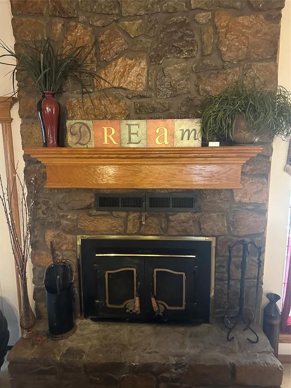 room details with a stone fireplace