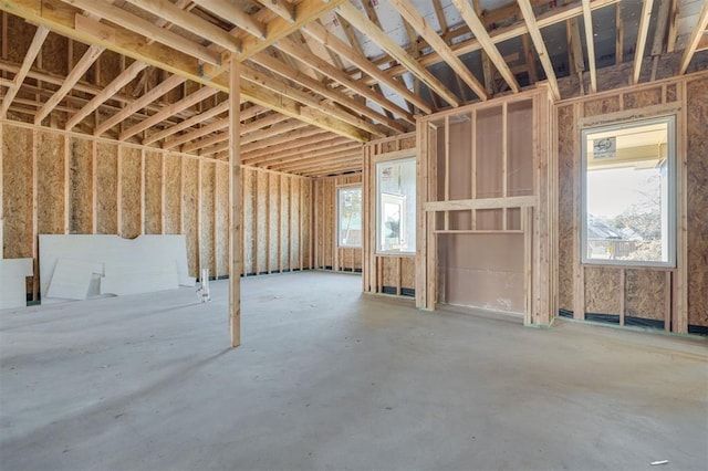 miscellaneous room with concrete floors and a healthy amount of sunlight