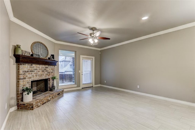 living room featuring crown molding, a fireplace, ceiling fan, and light hardwood / wood-style flooring