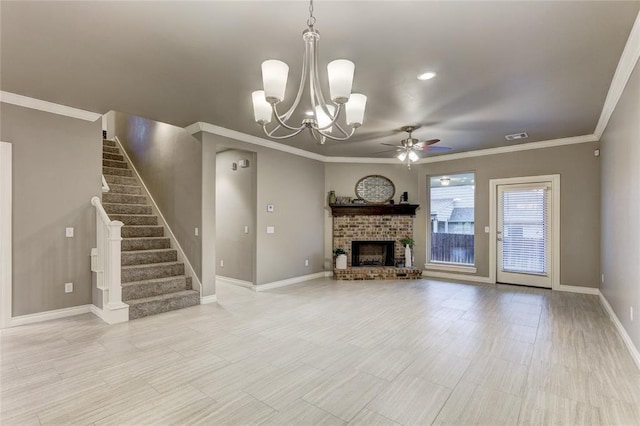 unfurnished living room featuring a fireplace, ceiling fan with notable chandelier, and ornamental molding