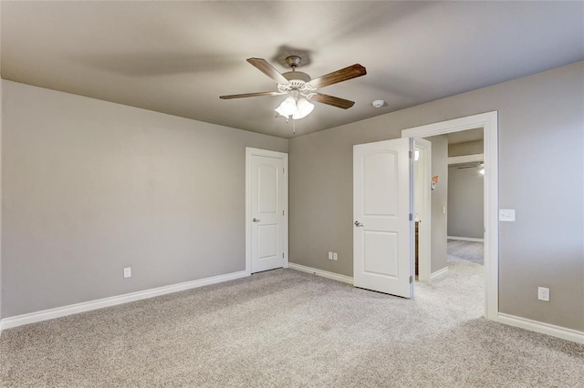 unfurnished bedroom with light colored carpet and ceiling fan