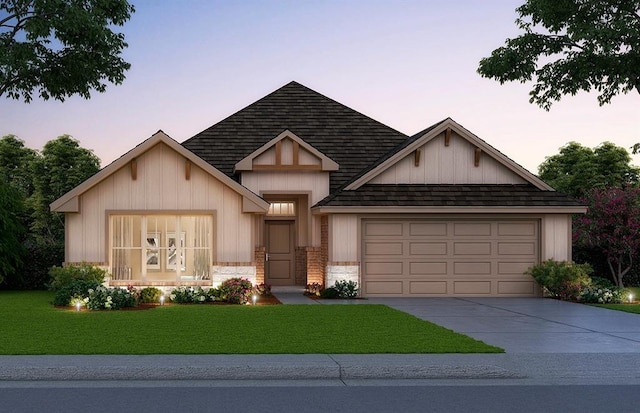 view of front facade with a garage, concrete driveway, roof with shingles, and a front lawn