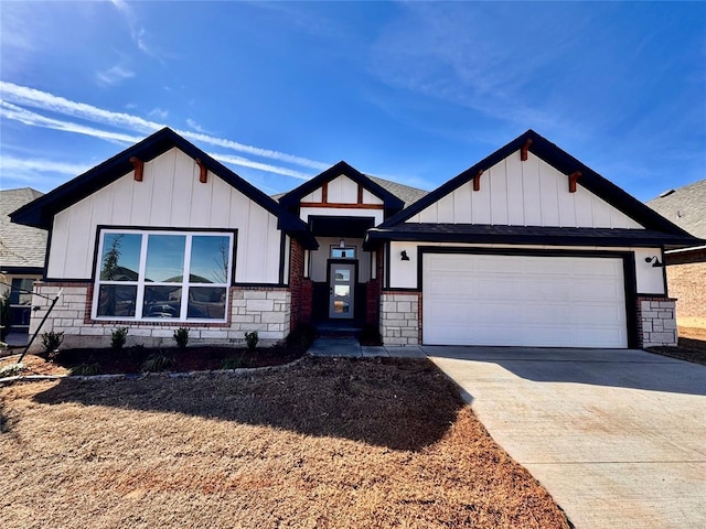 view of front of house featuring driveway, stone siding, board and batten siding, and an attached garage