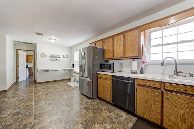 kitchen featuring stainless steel appliances and sink