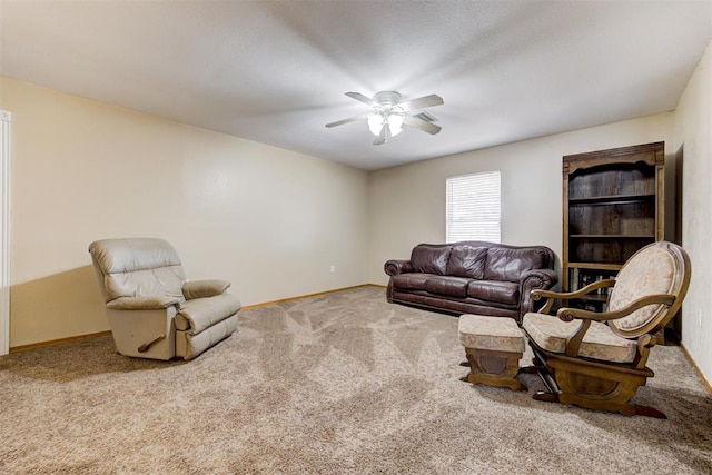 carpeted living room featuring ceiling fan