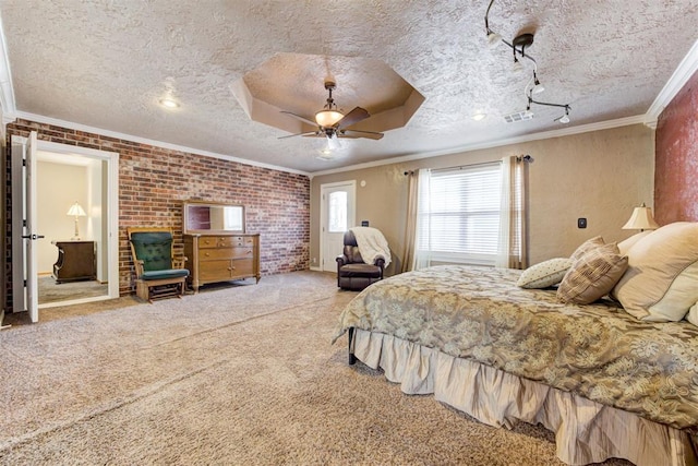 carpeted bedroom with ceiling fan, ornamental molding, a textured ceiling, and brick wall