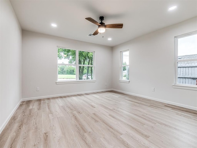 empty room with ceiling fan and light wood-type flooring