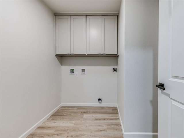 laundry room featuring cabinets, washer hookup, hookup for an electric dryer, and light hardwood / wood-style floors