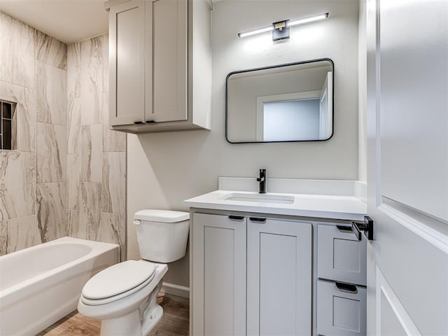 full bathroom featuring vanity, toilet, tiled shower / bath combo, and wood-type flooring