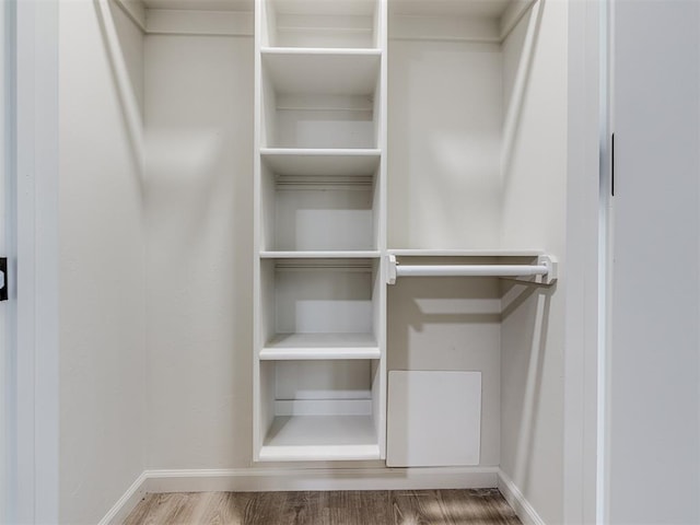 walk in closet featuring hardwood / wood-style flooring