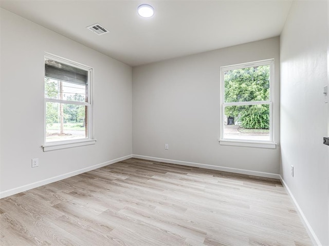 unfurnished room featuring light hardwood / wood-style flooring