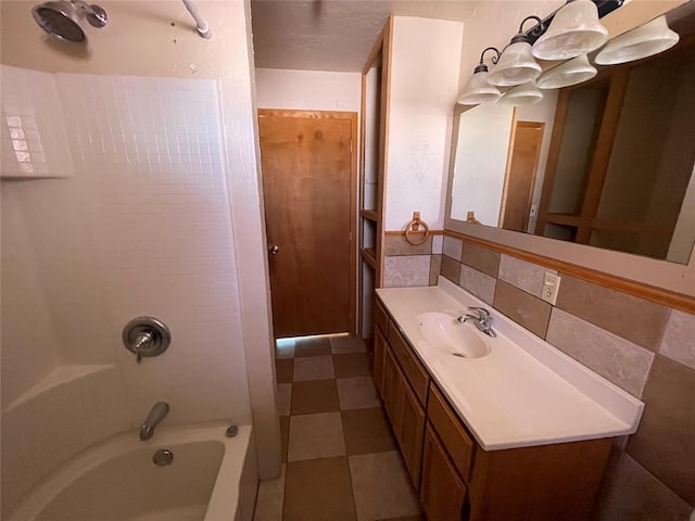 bathroom with vanity, shower / tub combination, and backsplash