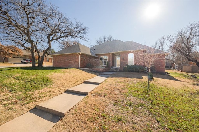 ranch-style house with a front lawn