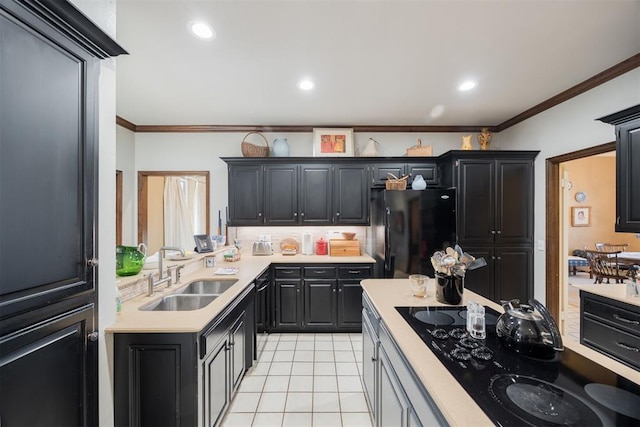 kitchen featuring light tile patterned floors, sink, crown molding, and black appliances