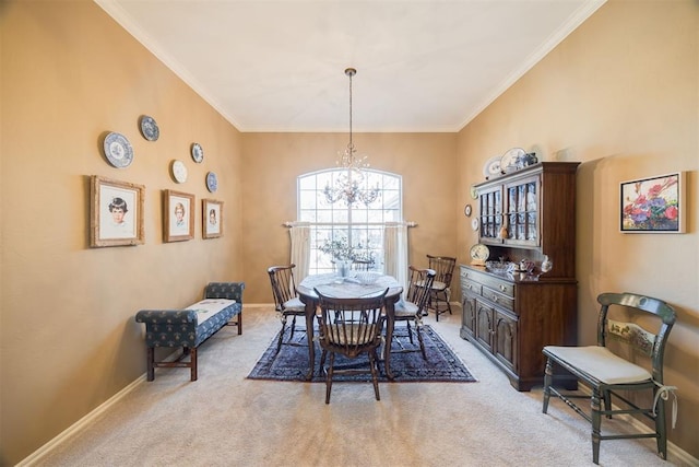 dining room featuring ornamental molding, light colored carpet, and a notable chandelier