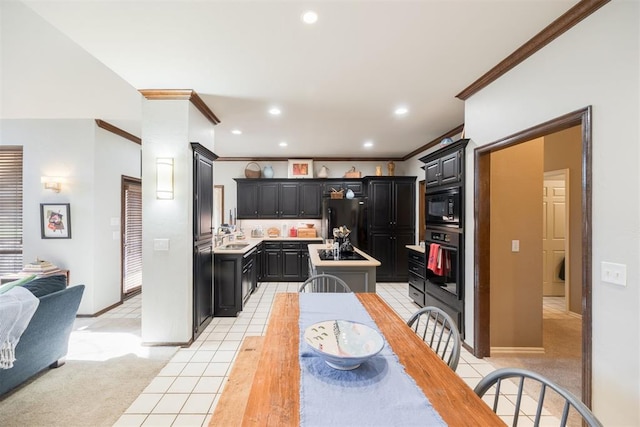 kitchen with light carpet, black appliances, sink, crown molding, and a kitchen island