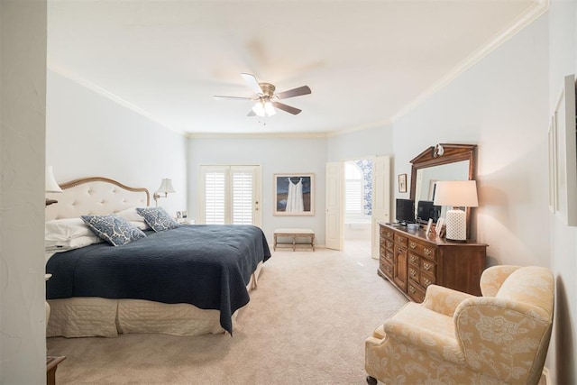 carpeted bedroom featuring ceiling fan and ornamental molding