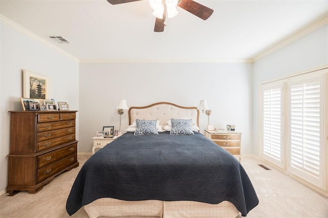 carpeted bedroom with ceiling fan and crown molding