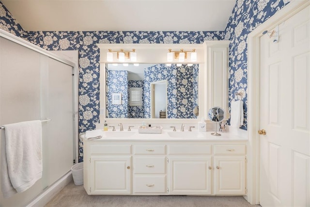 bathroom featuring vanity and a shower with shower door