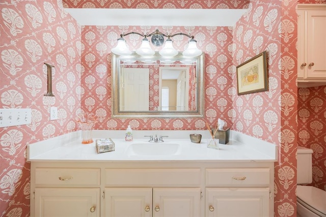 bathroom with vanity and toilet