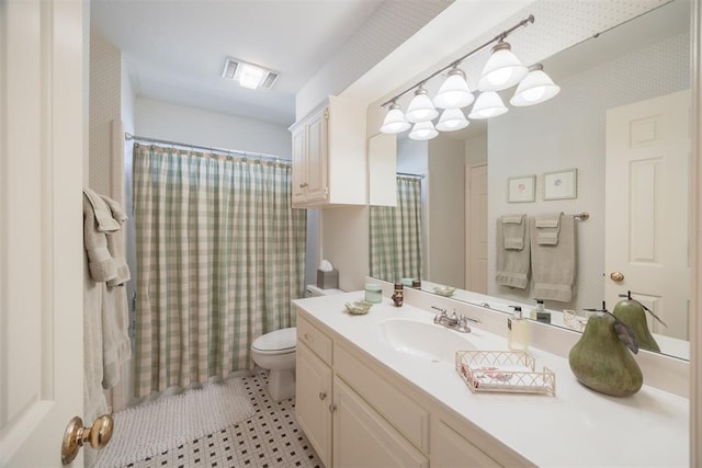 bathroom with a shower with curtain, vanity, and toilet