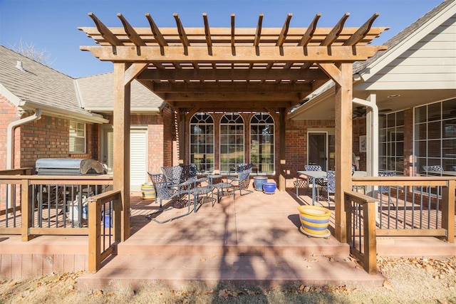 view of patio with a pergola, a wooden deck, and area for grilling