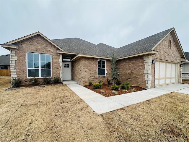 ranch-style home with brick siding and a shingled roof