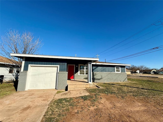 ranch-style house with a garage and a front lawn