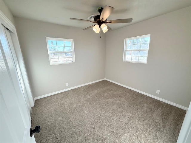 carpeted empty room with ceiling fan