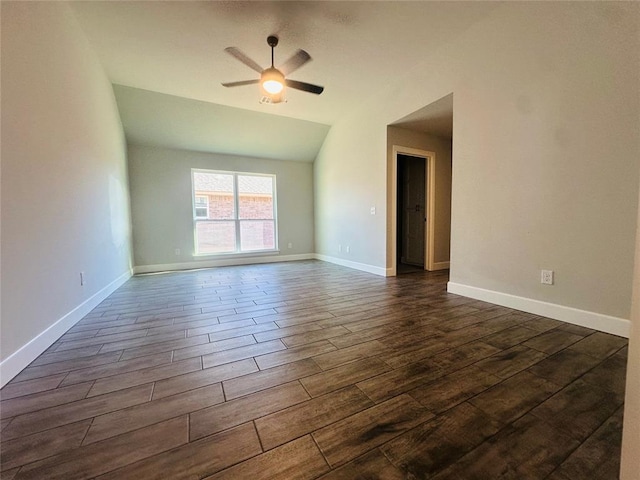 empty room featuring lofted ceiling and ceiling fan