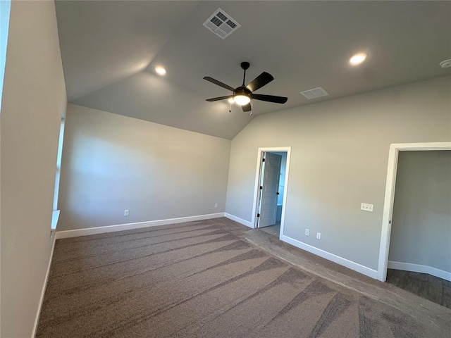 carpeted empty room featuring lofted ceiling and ceiling fan